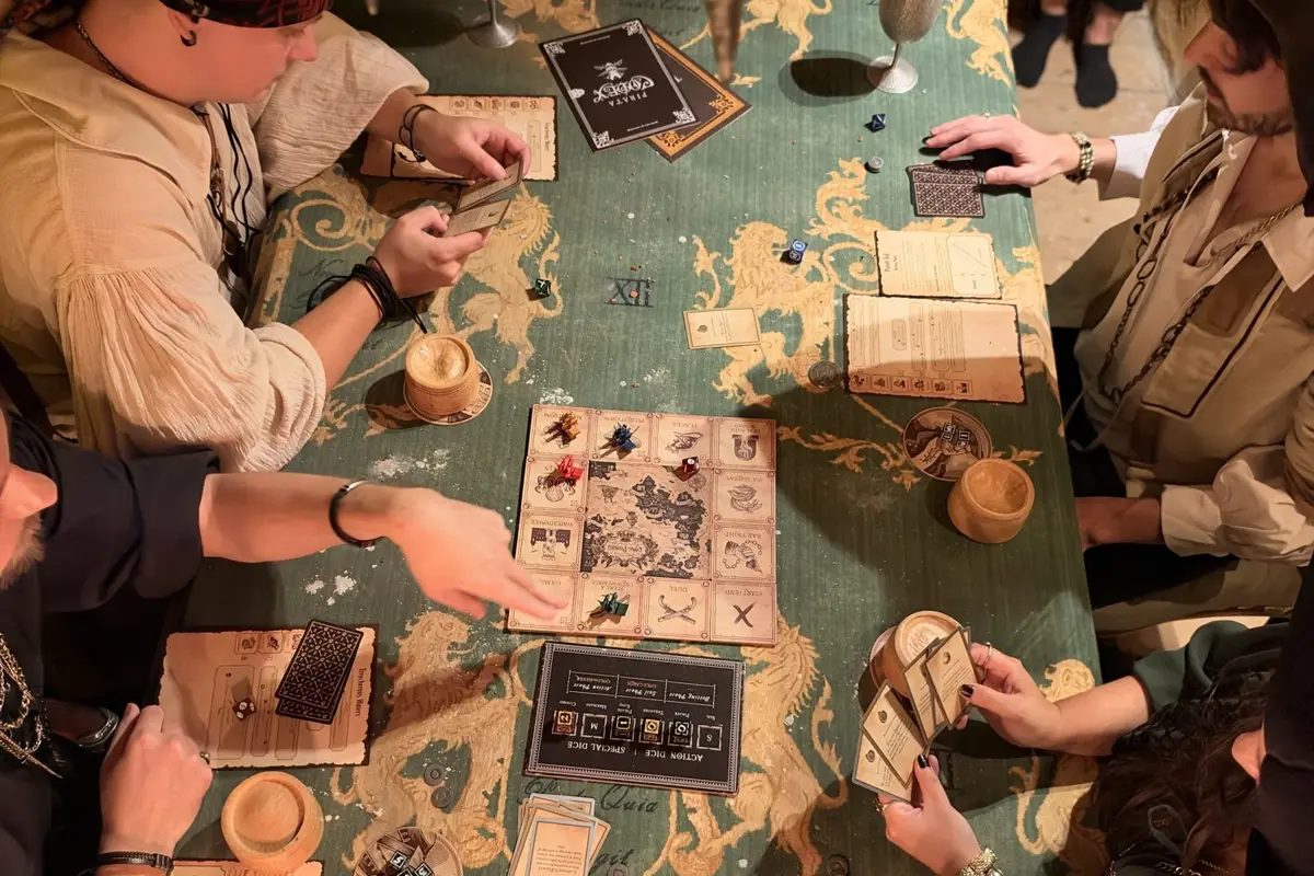 Captains around a Lying Pirates table